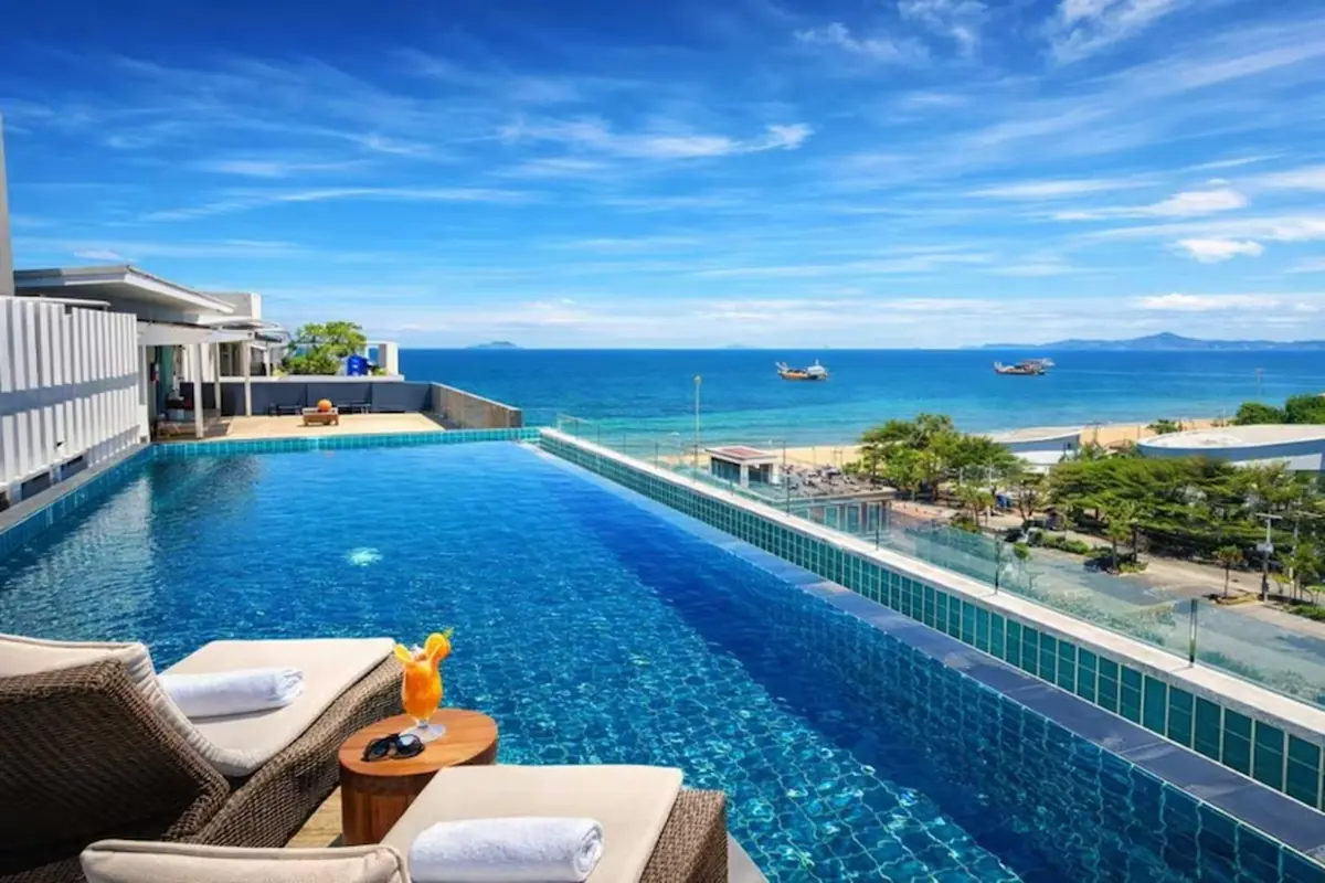 A tropical scene in Thailand — infinity pool, villa terrace, or coastal city view